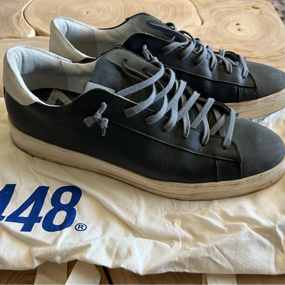 P448 Black and White Sneakers with Distinctive Stripe and Classic Midsole